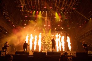 Photo of band playing in front of flames at Aftershock 2022 festival.