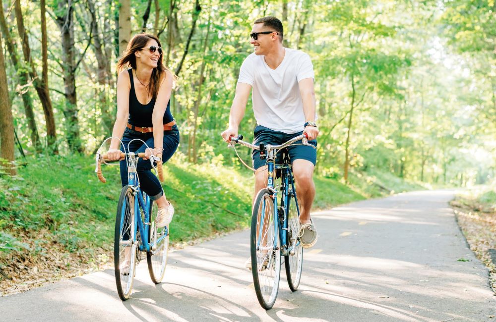 Couple Riding Along the Prisma Health Swamp Rabbit Trail