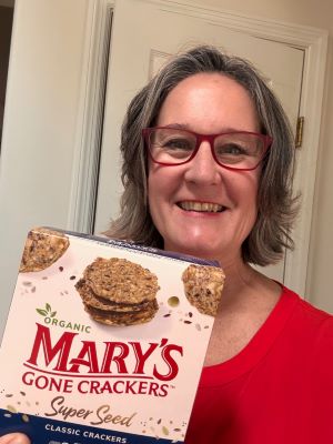 Tracy Stuckrath holding a box of Mary's Gone Crackers