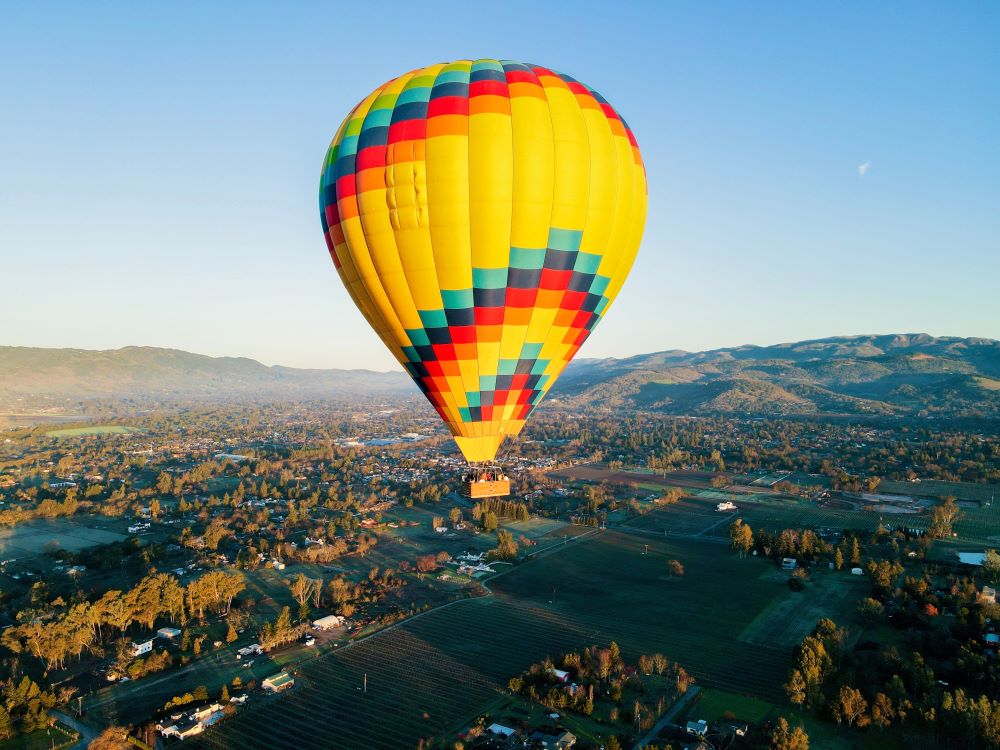 Photo of colorful hot-air balloon floating over Sonoma County.