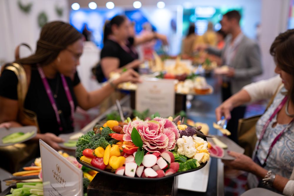 Photo of attendees accessing a buffet at Healthcare Advocate Summit.