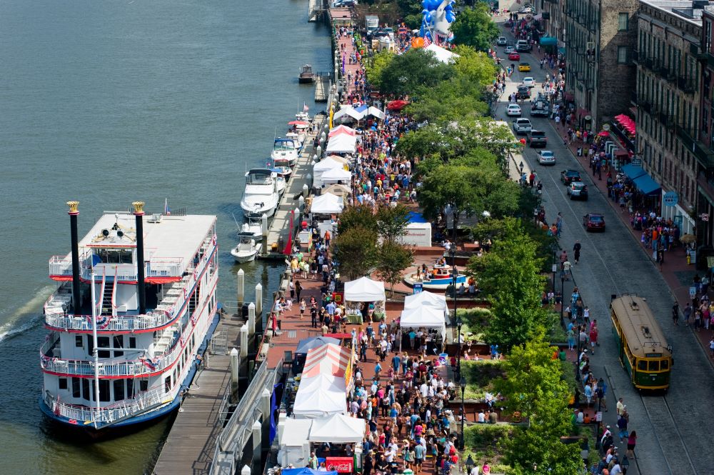 Photo of Savannah's River Street, crowded with people.