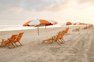 Cinnamon Shore beach with chairs and umbrellas COURTESY Cinnamon Shore