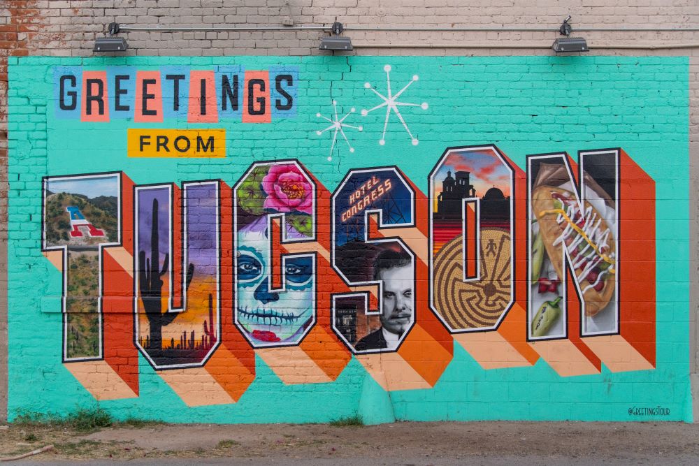 Photo of colorful mural reading Greetings from Tucson.