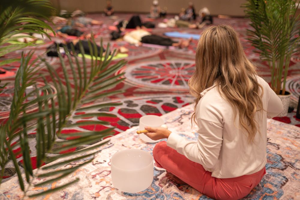 Photo of Tiffany Zwinge Barger leading a soundbath program at Healthcare Advocate Summit.