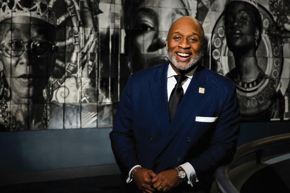 Photo of Jason Dunn, smiling in a blue suit.