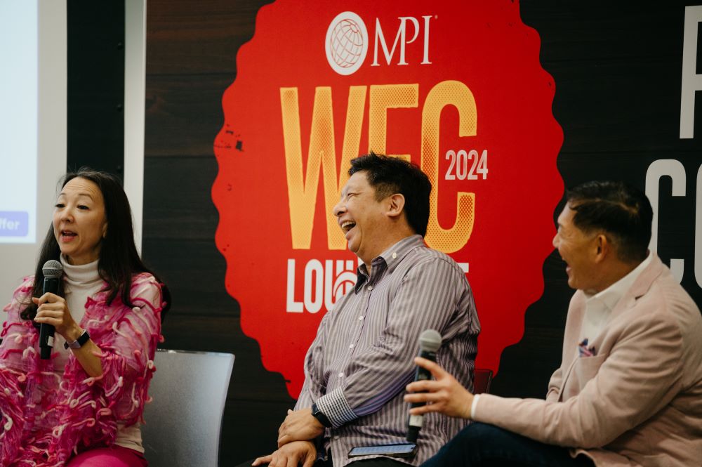 Photo of Jolene Jang, John Chen and Gary Murakami at MPI WEC, on stage during panel discussion.