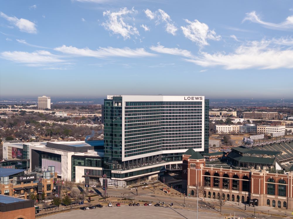 Exterior photo of Loews Arlington Hotel and Convention Center and the surrounding Entertainment District.