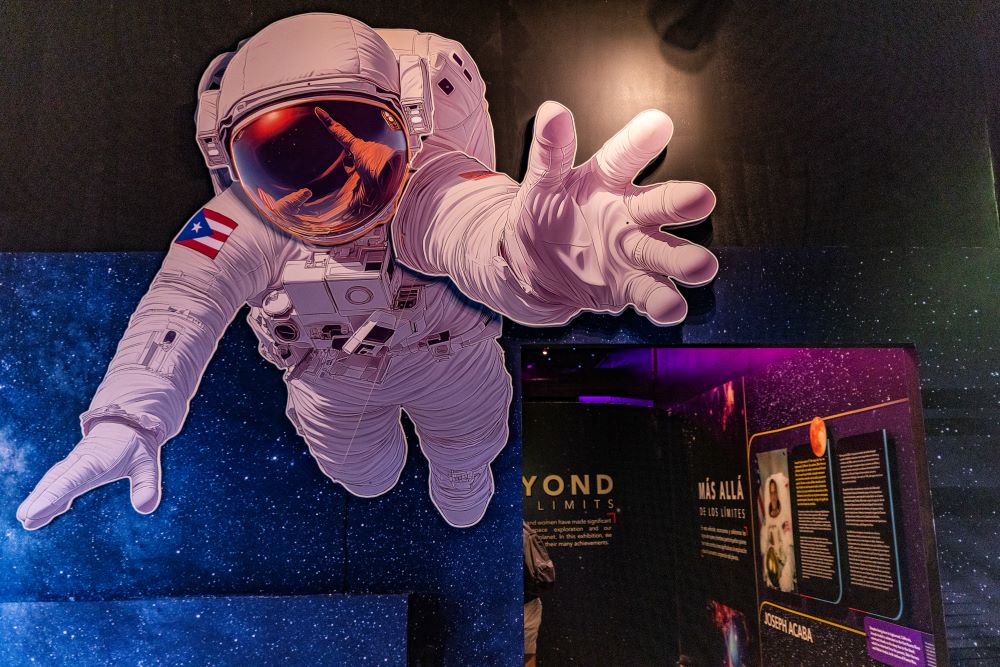 Graphic of astronaut in space at Planet of Imagination.