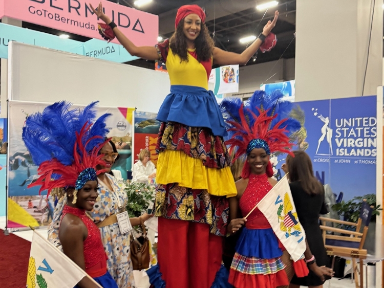 Stilt Dancers at the Go To Bermuda Booth