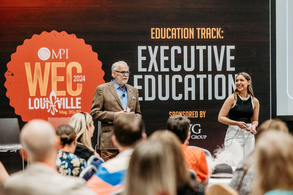 Photo of Michael Owen and Taylor Smith delivering education program at MPI WEC 2024.