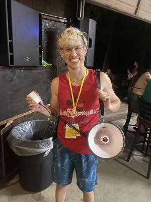 Photo of Chase Brunson with a bullhorn, smiling.