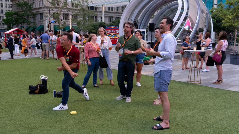 Attendees play games at AT&T Discovery District during DI's opening celebration
