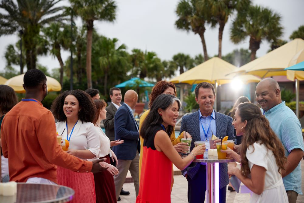 Attendees mingling over drinks in Orlando