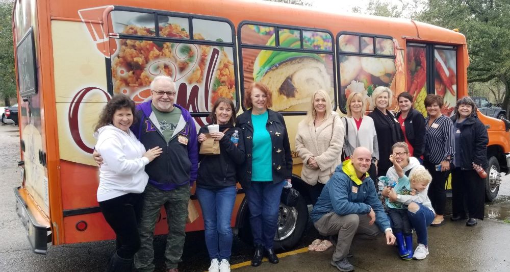Group outside the Cajun Food Tours Bus