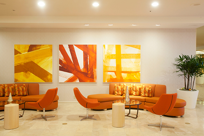 Hotel Irvine Seating Area With Signature Orange Palette