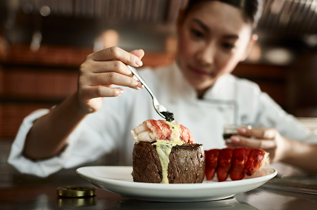 Chef Preparing Steak Lobster Dish, Credit: Visit Orlando