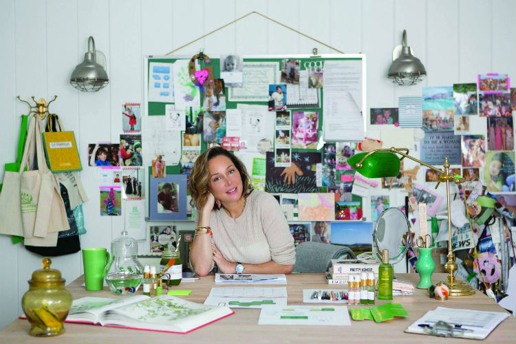 Tata Harper at Desk With Skincare Products