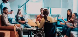 Woman in wheelchair at a business meeting