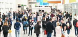 Image of a crowd of people at an event, walking.