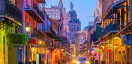 Photo of New Orleans' Bourbon street at dusk.