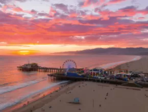 Pacific Park on the Santa Monica Pier at sunset.