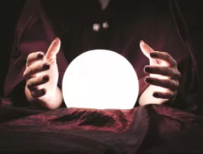 Image of fortune teller and crystal ball.