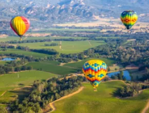 Hot air balloons flying over California's Napa Valley