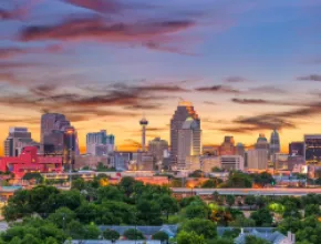 Photo of San Antonio skyline at dusk.