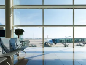 View of planes from the window of the gate area at an airport