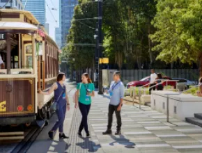 Meeting attendees outside of the trolley in downtown Dallas