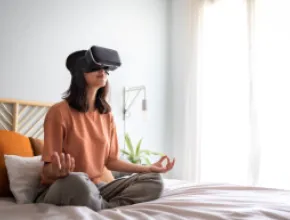 Woman Meditates With VR Headset