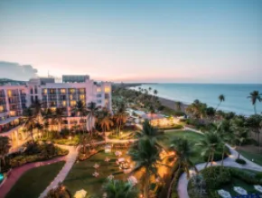 Aerial photo of Wyndham Grand Rio Mar Rainforest Beach and Golf Resort with Caribbean in the background.