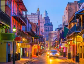 Photo of New Orleans' Bourbon street at dusk.