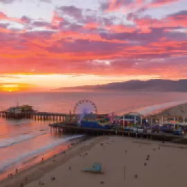 Pacific Park on the Santa Monica Pier at sunset.