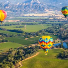 Hot air balloons flying over California's Napa Valley