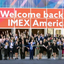 IMEX America staff welcoming attendees.