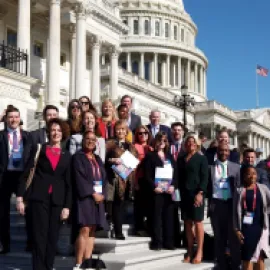 Photo of U.S. travel industry leaders on the steps of the U.S. Capitol.