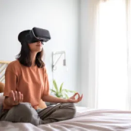 Woman Meditates With VR Headset