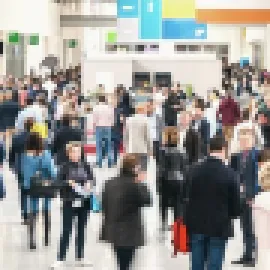 Image of a crowd of people at an event, walking.