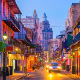 Photo of New Orleans' Bourbon street at dusk.