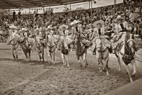 Women riders perform famous "El Abanico" routine as part of traditional Charro Escaramuza celebration during Fiesta, San Antonio, 2018