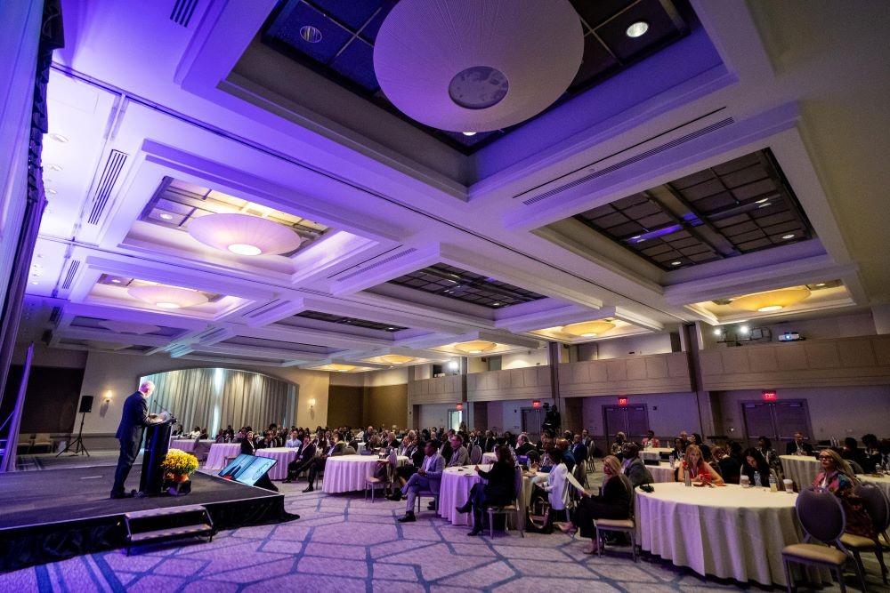 Photo of general session in ballroom at The Collective Experience conference.