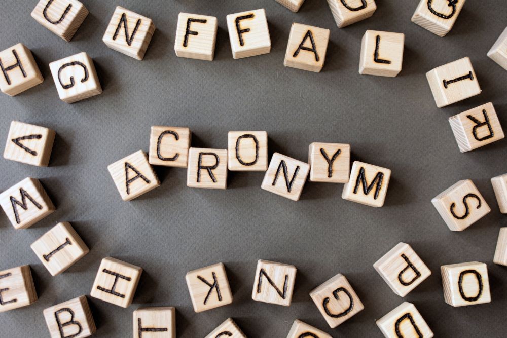 A photo of blocks in an array that spells out "acronyms"