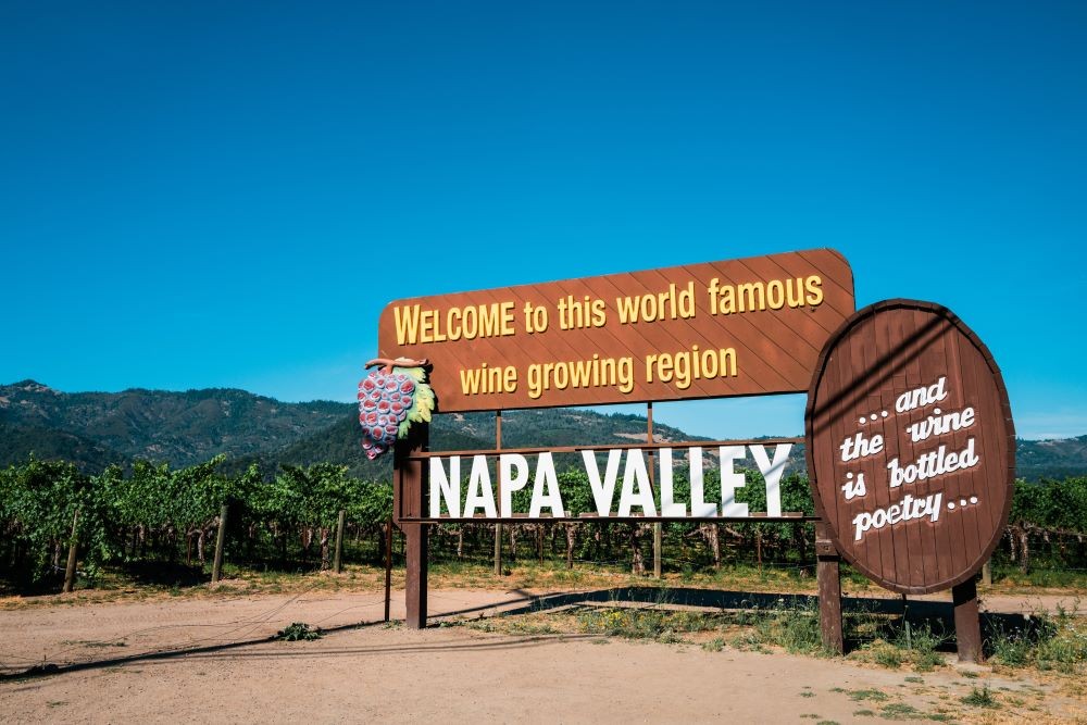 Photo of Napa Valley welcome sign in vineyard.