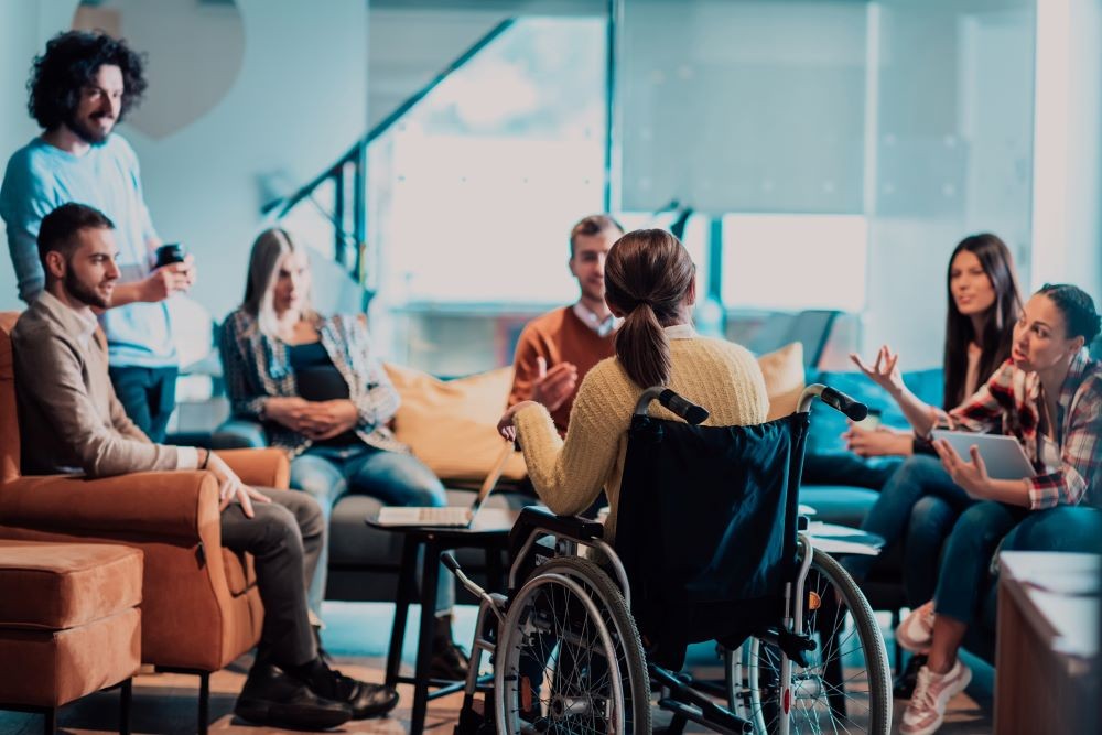 Woman in wheelchair at a business meeting