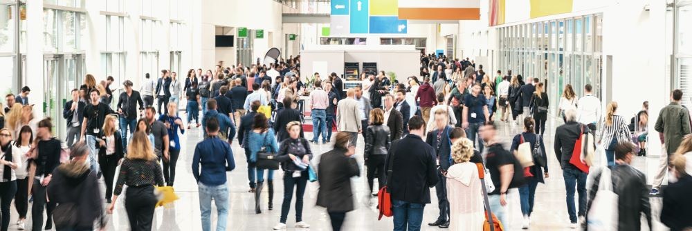 Image of a crowd of people at an event, walking.